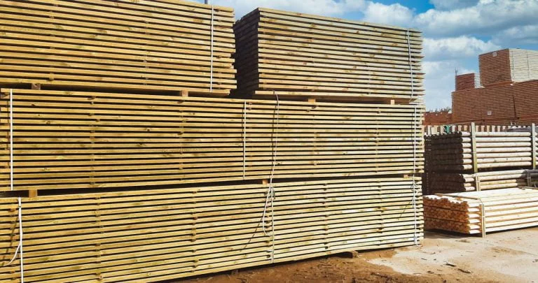 Impregnated woodpoles stack